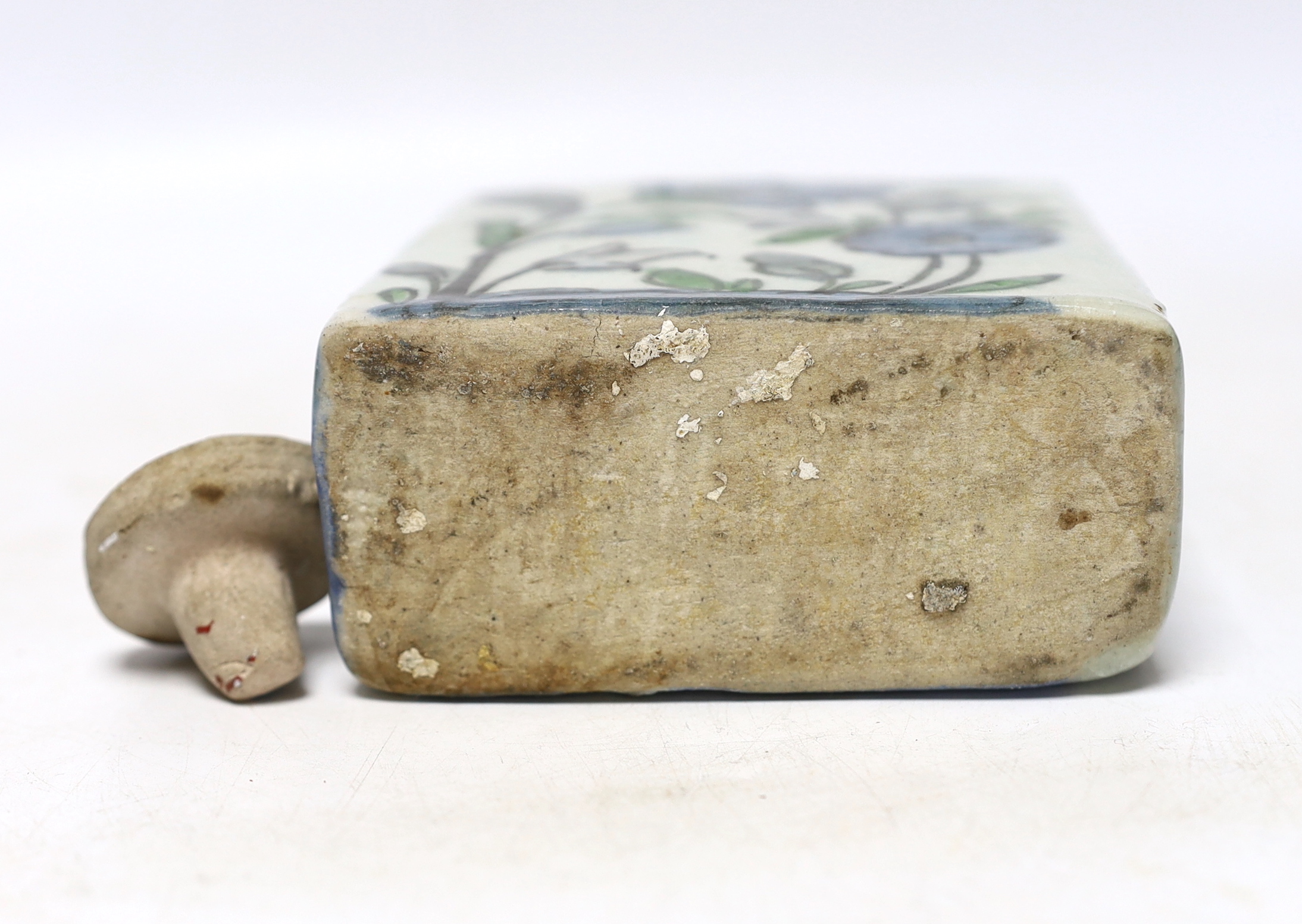 An Iznik tin-glazed pottery flask and cover, 15cm